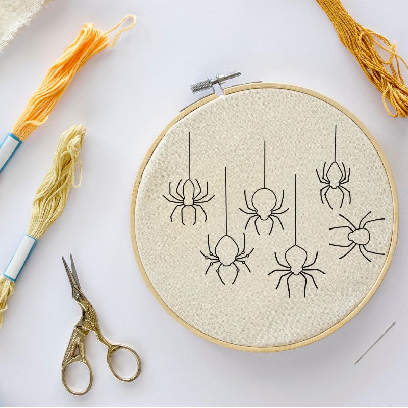 Grille de broderie: araignées